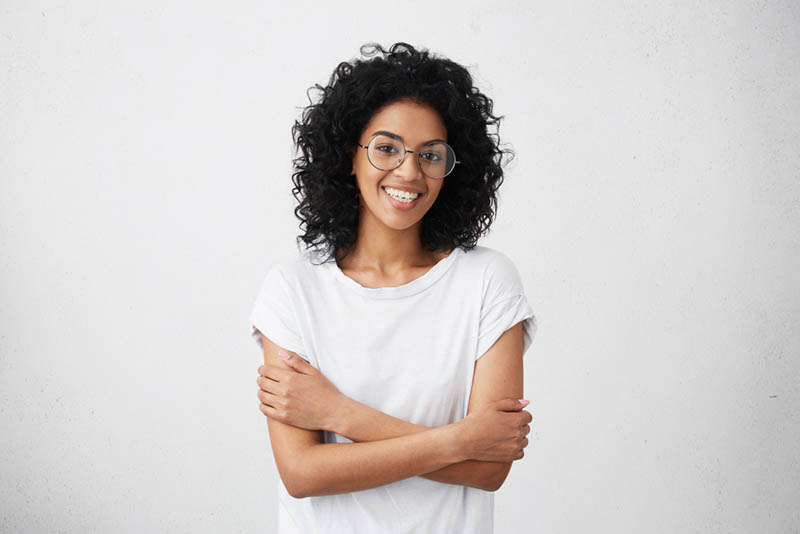 AI student smiling confidently indoors